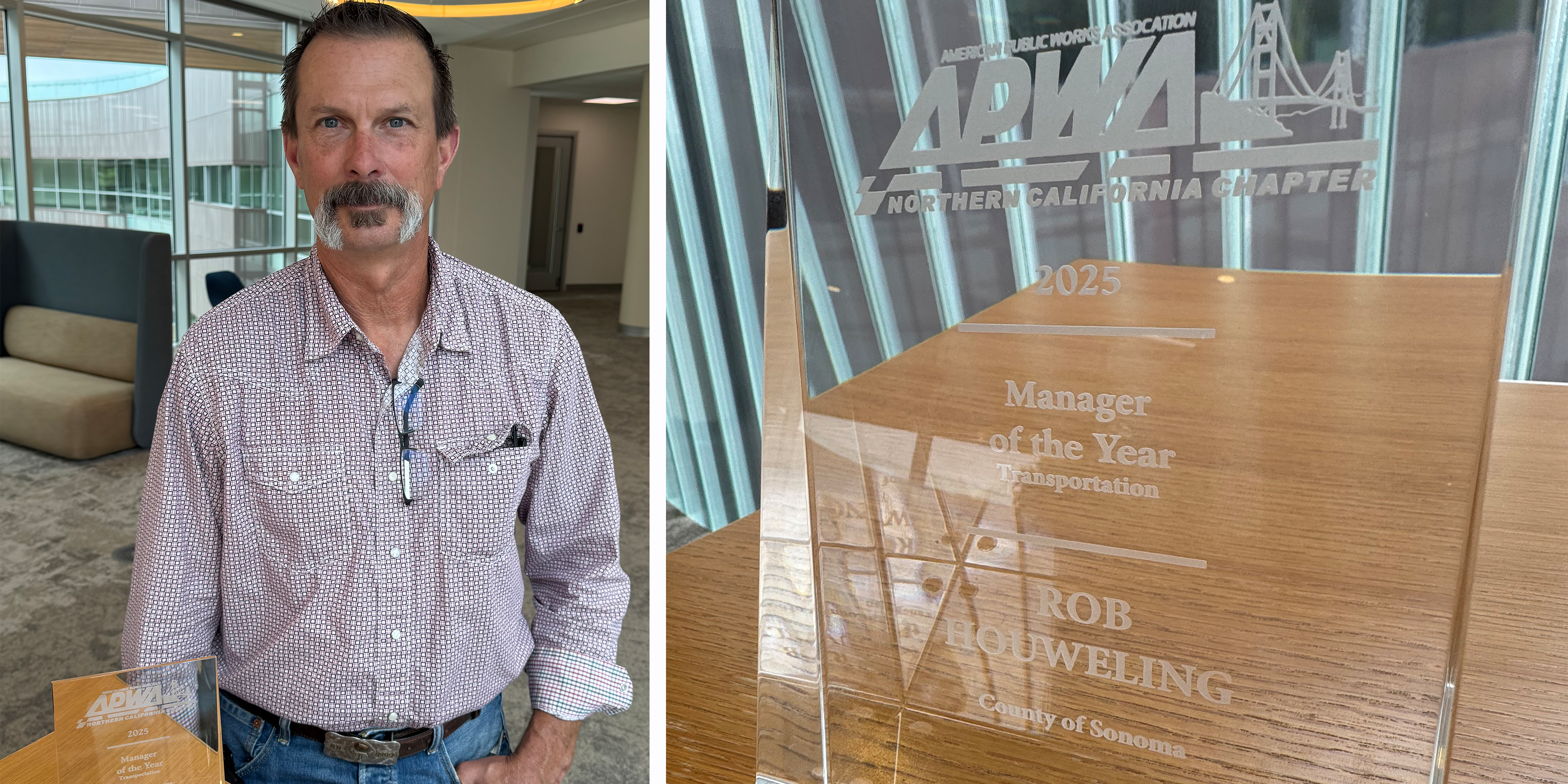 Staff member holding award for best manager of 2025. close-up of award